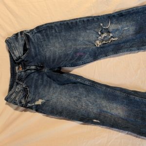 Girls ripped acid wash jeans
